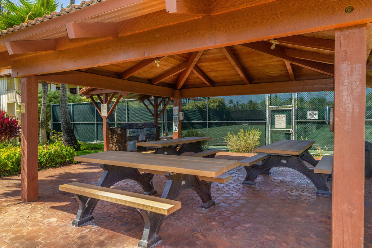 1870 Hoone Road, Unit 602 Koloa, HI 96756 - Photo 25 of 26 a view of an outdoor sitting area with a table and chairs