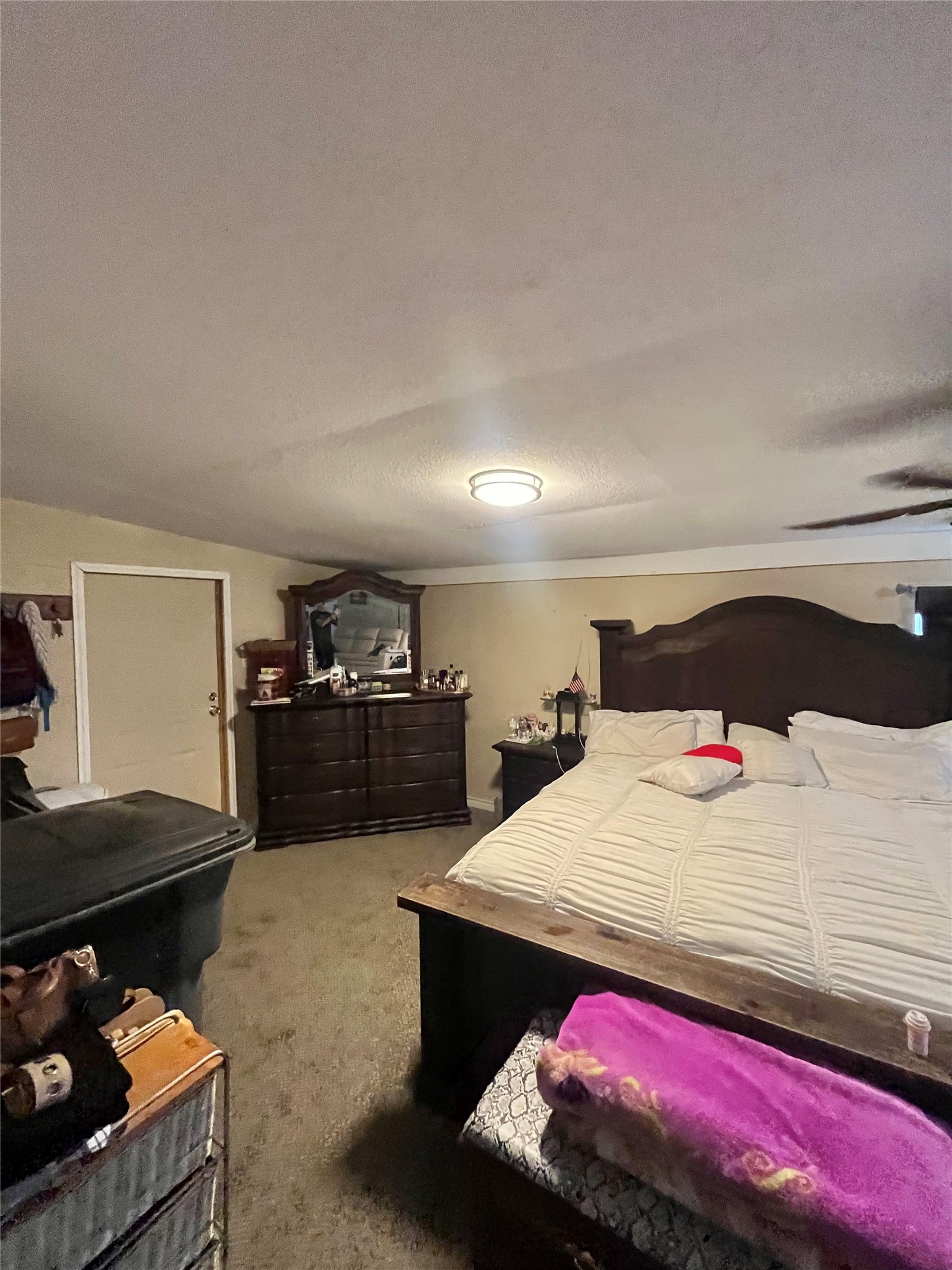 8026 Forest Trace Conroe, TX 77306 - Photo 20 of 28 a bedroom with a bed and a dresser