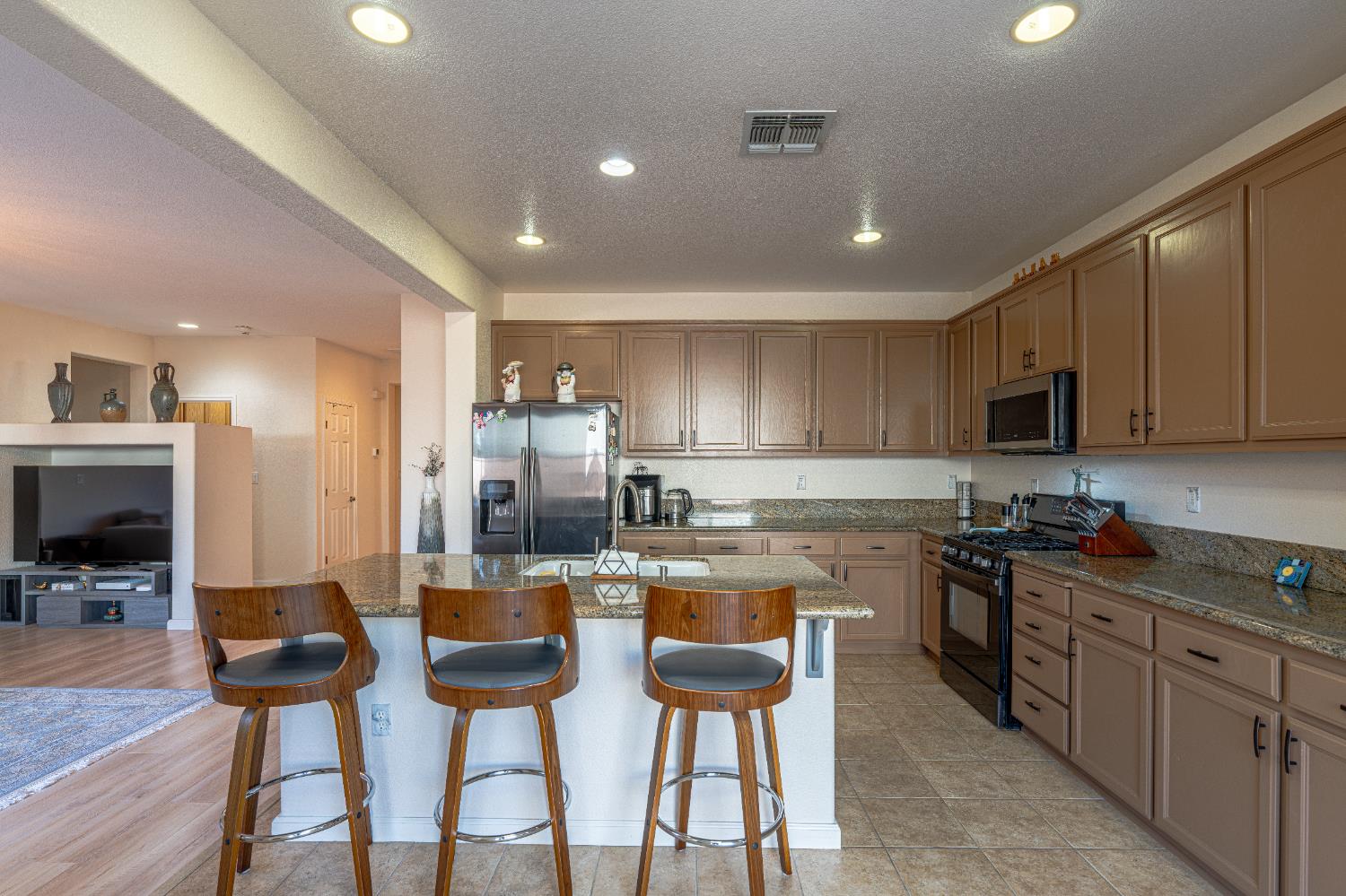 3710 Huntington Road West Sacramento, CA 95691 - Photo 14 of 46 a kitchen with cabinets and chairs