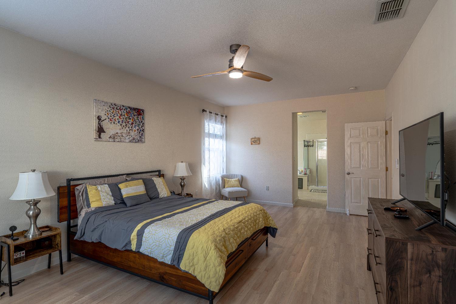 3710 Huntington Road West Sacramento, CA 95691 - Photo 21 of 46 a bedroom with a large bed and a tv