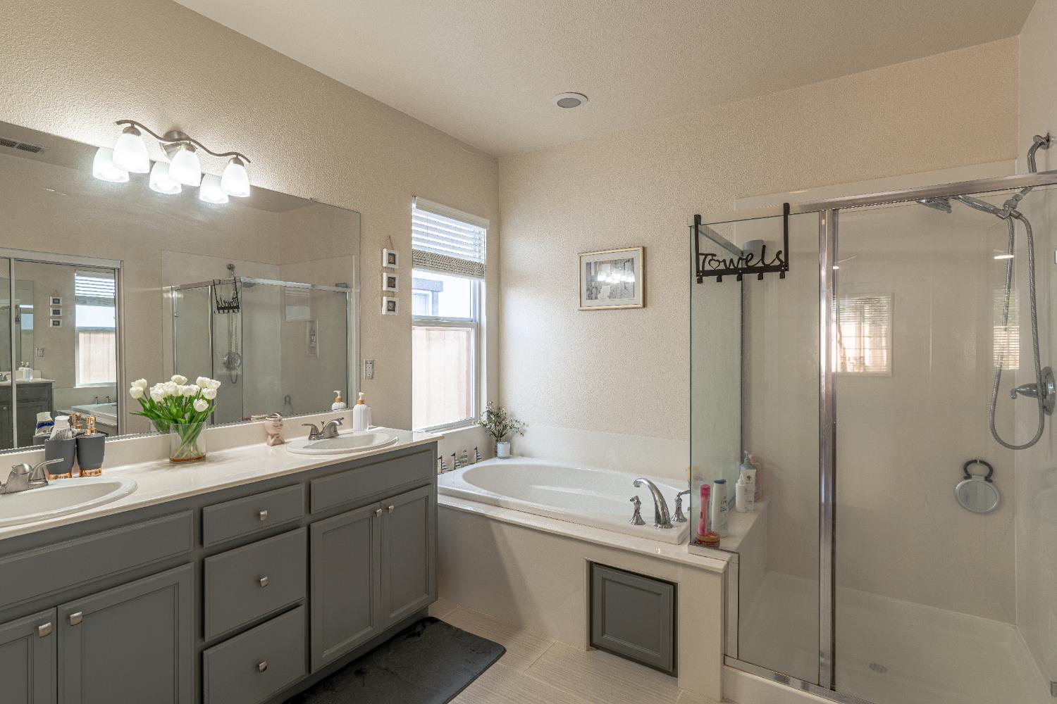 3710 Huntington Road West Sacramento, CA 95691 - Photo 22 of 46 a bathroom with a double vanity sink mirror and shower