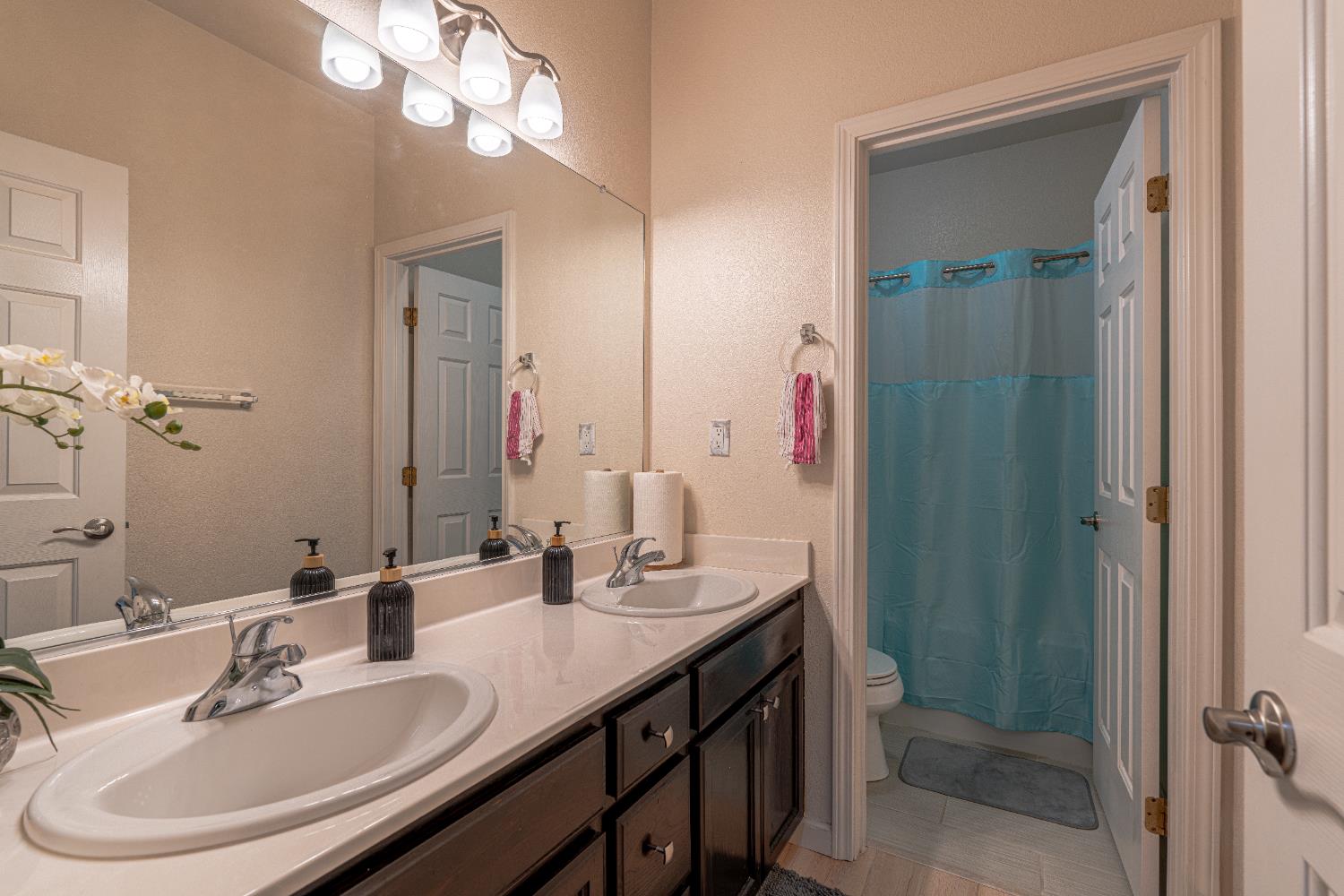 3710 Huntington Road West Sacramento, CA 95691 - Photo 35 of 46 a bathroom with a sink and a mirror