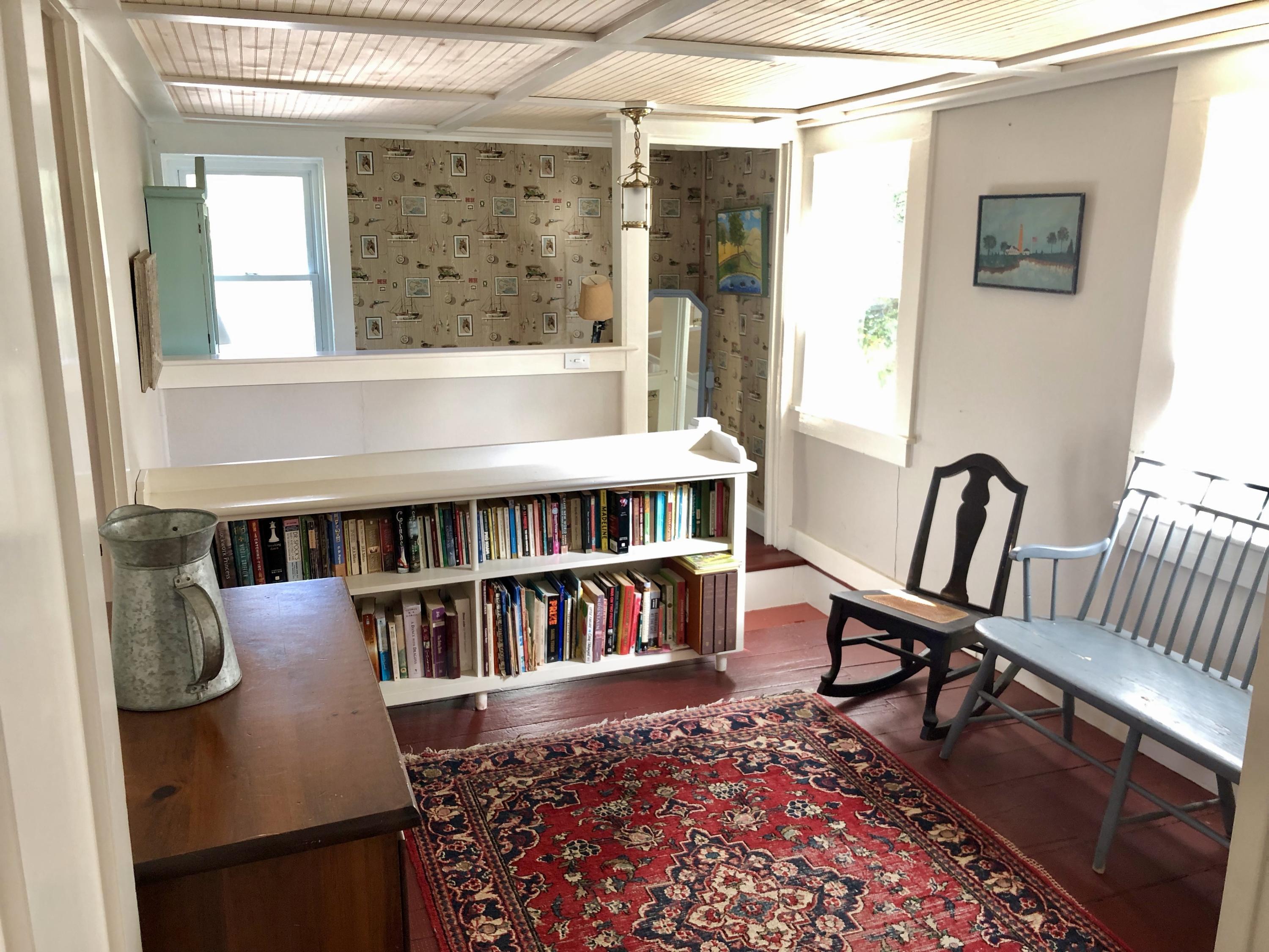 11 Pond Road Truro, MA 02666 - Photo 23 of 25 a view of a workspace with furniture and a book shelf