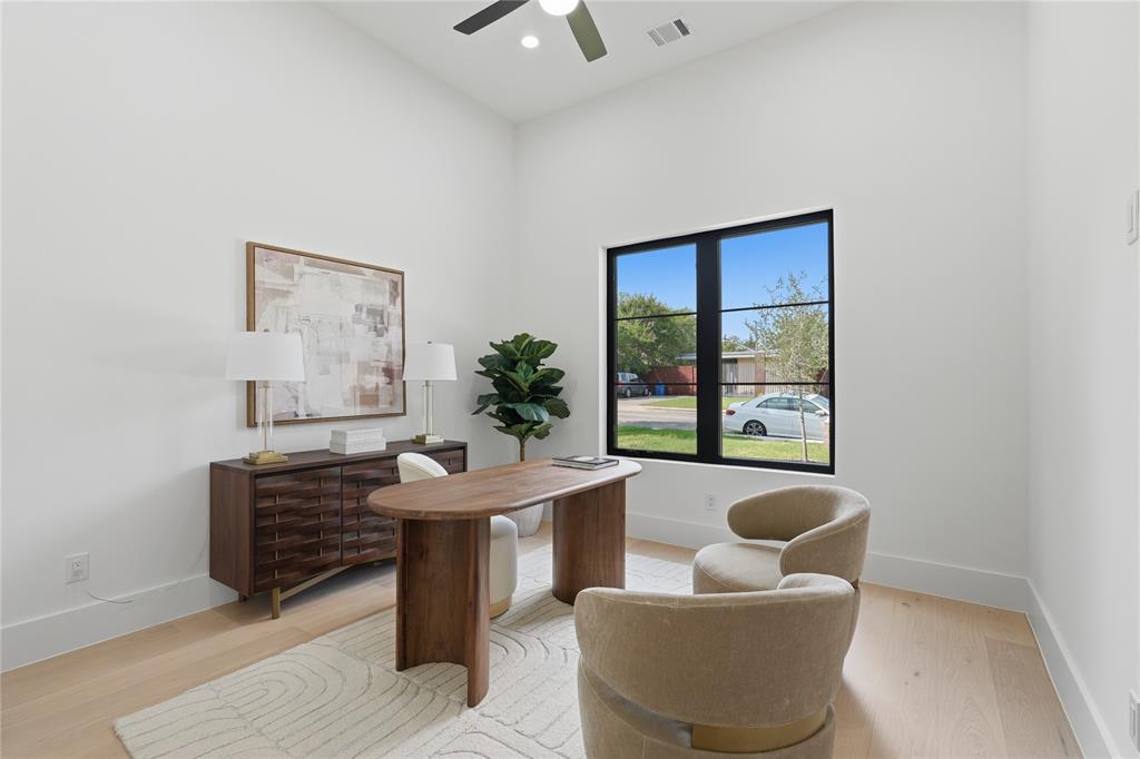 6038 Prospect Avenue Dallas, TX 75206 - Photo 4 of 40 High ceilings with a ceiling fan, light wood-finish flooring, and a large black-framed window