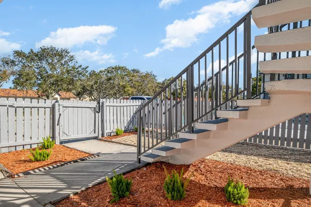 a view of a chair with wooden fence