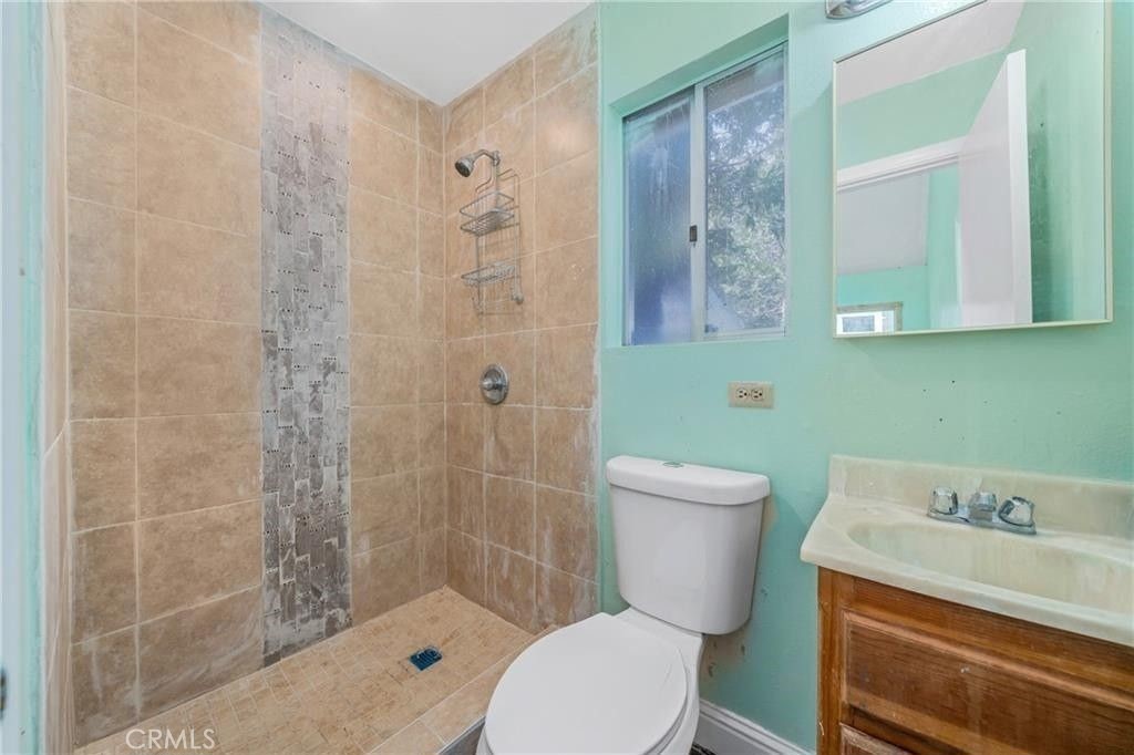 23884 Bowl Road Crestline, CA 92325 - Photo 5 of 9 a bathroom with a toilet a sink and shower