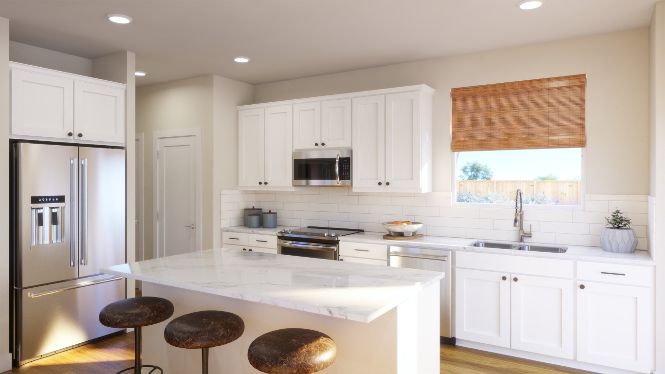 156 Sycamore Pnes Lane Kyle, TX 78640 - Photo 8 of 17 a kitchen with a sink stove and refrigerator