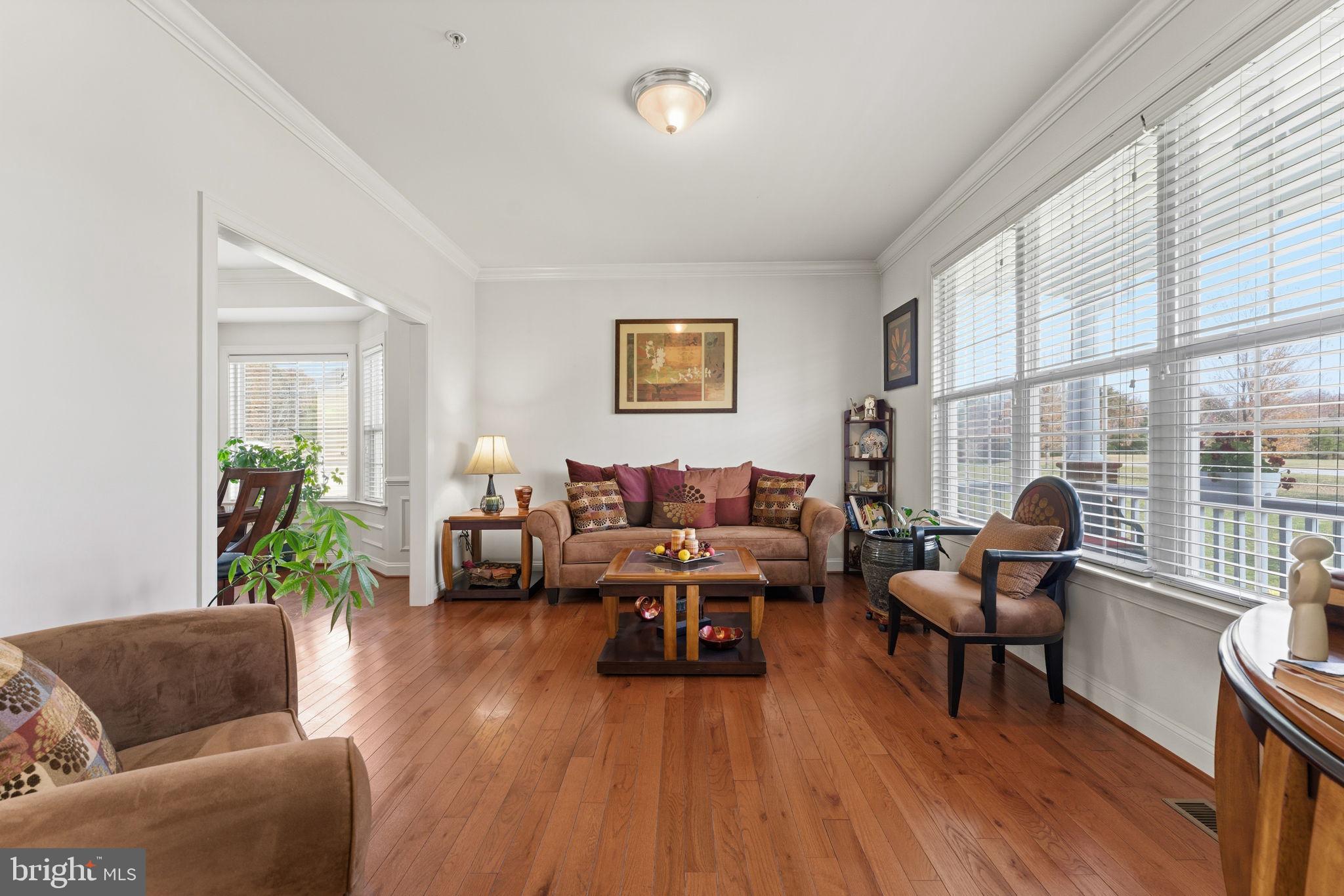 4505 Coachmans Path Court Waldorf, MD 20601 - Photo 11 of 71 a living room with furniture and wooden floor