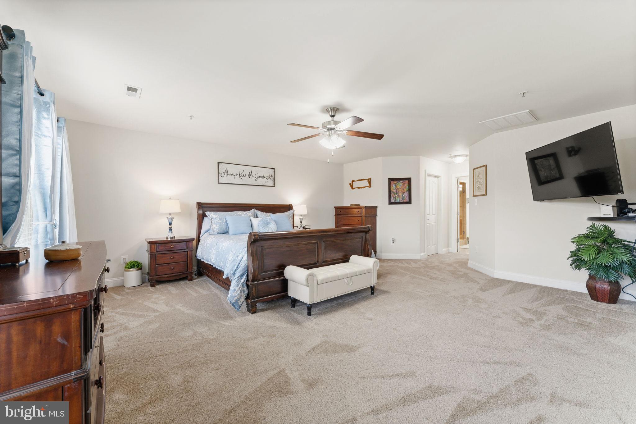 4505 Coachmans Path Court Waldorf, MD 20601 - Photo 28 of 71 a bed room with furniture and a flat screen tv