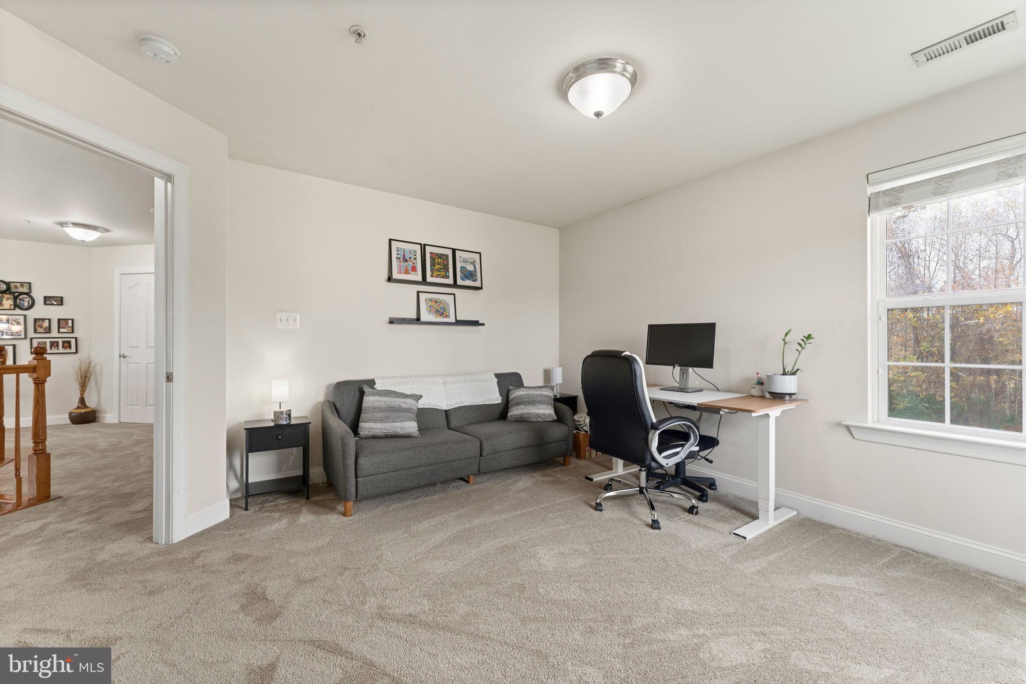 4505 Coachmans Path Court Waldorf, MD 20601 - Photo 38 of 71 a view of a livingroom with workspace and a window