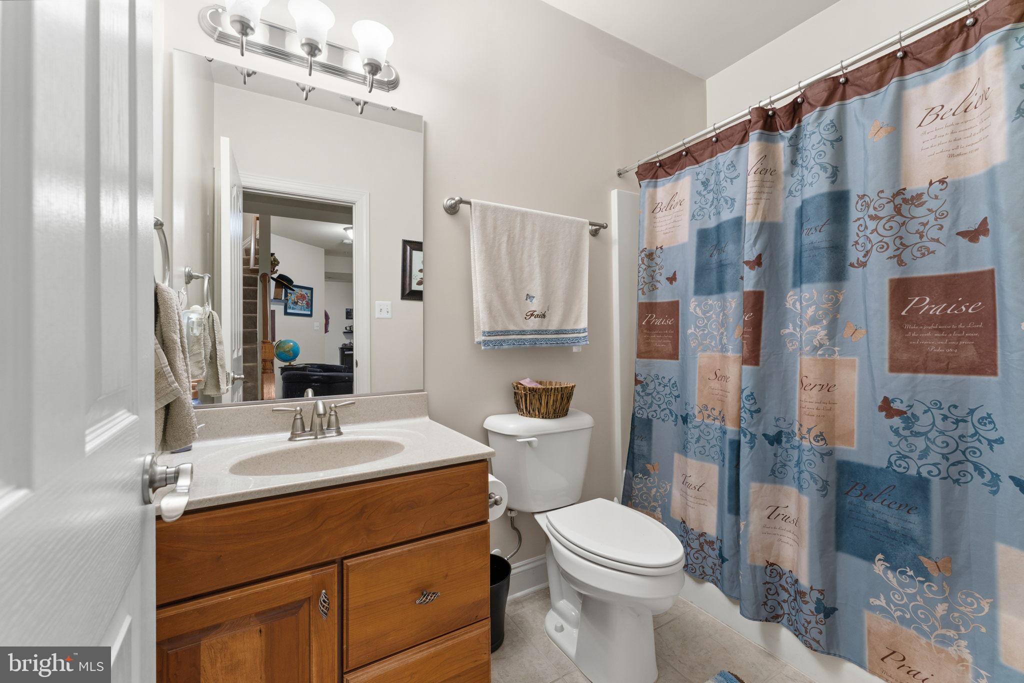 4505 Coachmans Path Court Waldorf, MD 20601 - Photo 41 of 71 a bathroom with a sink vanity mirror and toilet