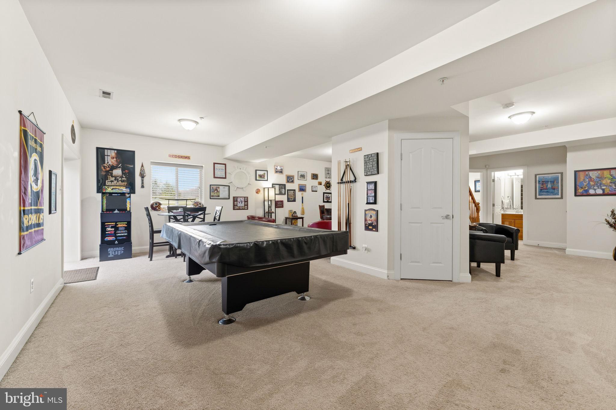 4505 Coachmans Path Court Waldorf, MD 20601 - Photo 45 of 71 a living room with furniture and a dining table with bookshelf