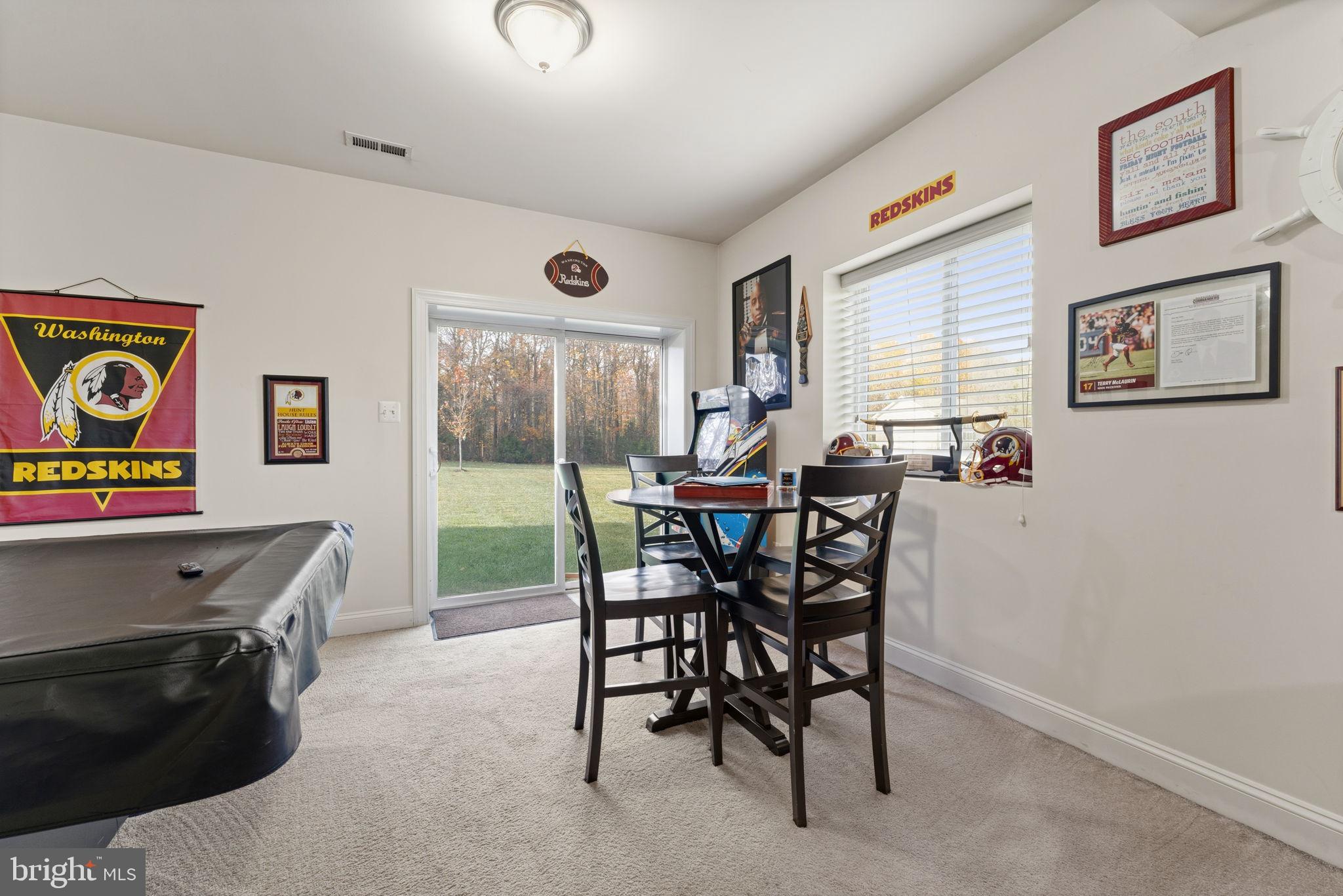 4505 Coachmans Path Court Waldorf, MD 20601 - Photo 47 of 71 a view of a dining room with furniture and a floor to ceiling window