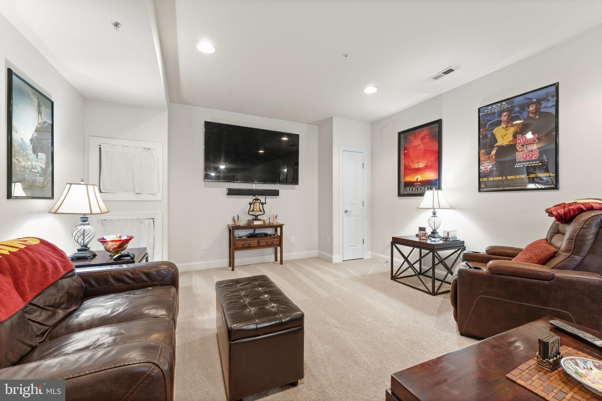 4505 Coachmans Path Court Waldorf, MD 20601 - Photo 49 of 71 a living room with furniture and a flat screen tv