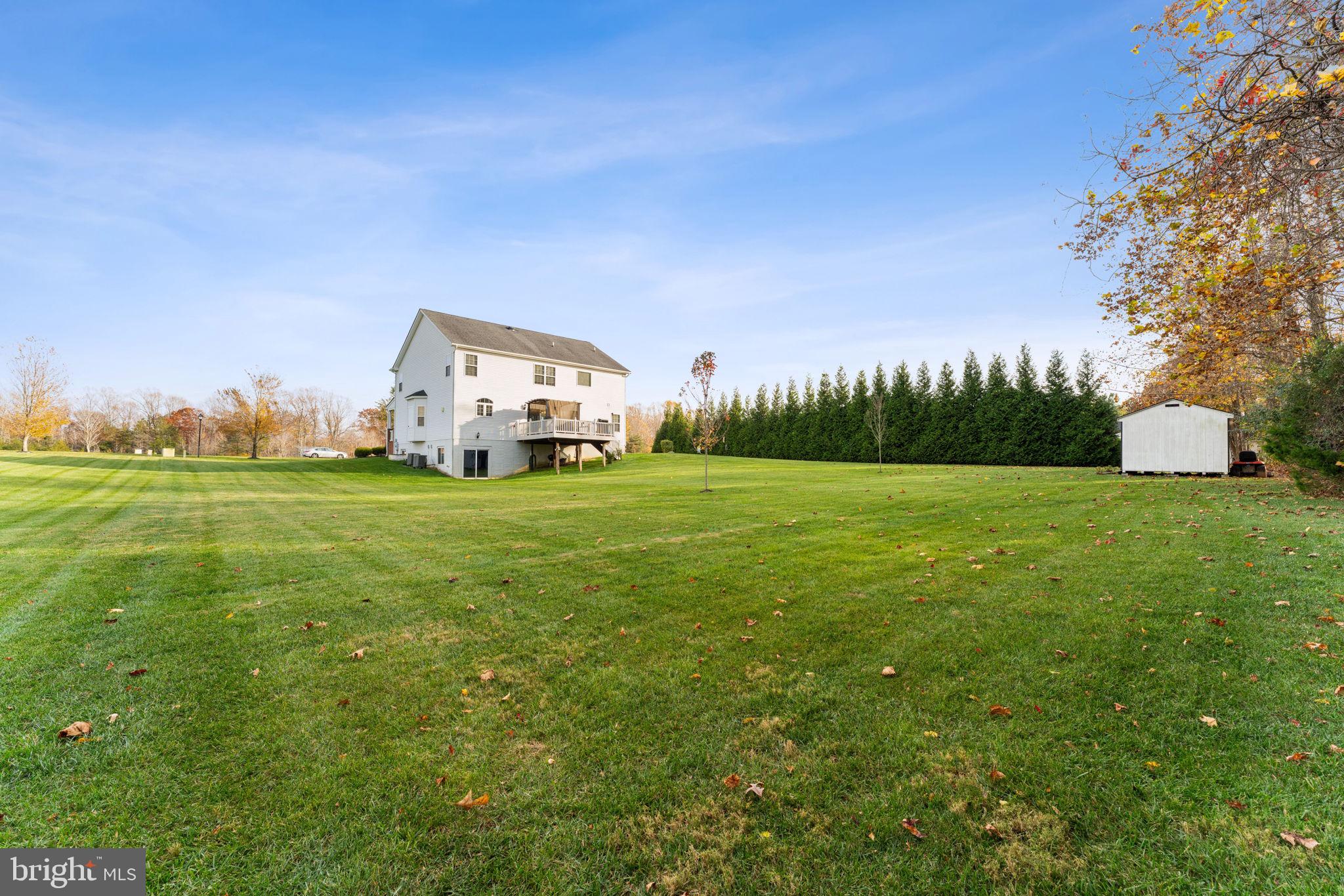 4505 Coachmans Path Court Waldorf, MD 20601 - Photo 58 of 71 a view of a grassy field with an trees