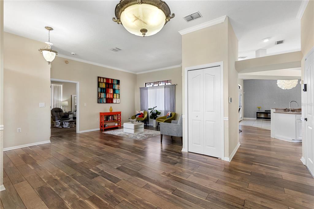 13481 Pullman Drive Spring Hill, FL 34609 - Photo 11 of 41 a view of a living room and a wooden floor