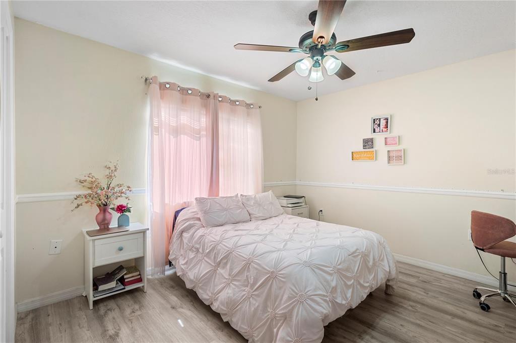 13481 Pullman Drive Spring Hill, FL 34609 - Photo 16 of 41 a bedroom with a bed dresser and a window