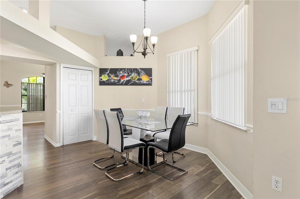 13481 Pullman Drive Spring Hill, FL 34609 - Photo 23 of 41 a view of a dining room with furniture window and wooden floor