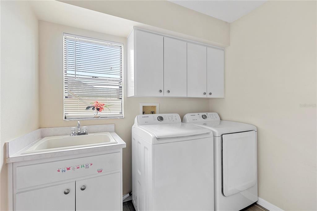 13481 Pullman Drive Spring Hill, FL 34609 - Photo 28 of 41 a utility room with dryer and washer