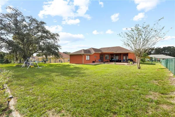 a view of a house with a big yard
