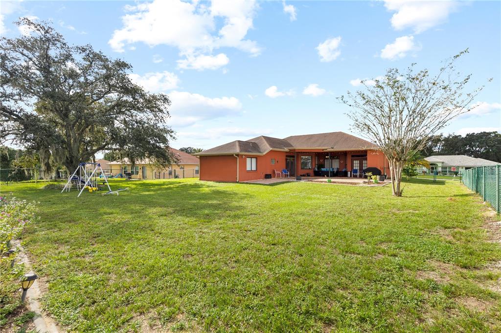 13481 Pullman Drive Spring Hill, FL 34609 - Photo 33 of 41 a view of a house with a big yard