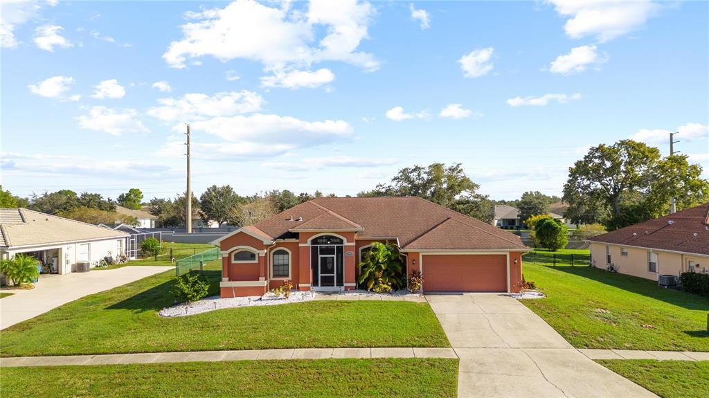 13481 Pullman Drive Spring Hill, FL 34609 - Photo 6 of 41 a view of a house with a big yard