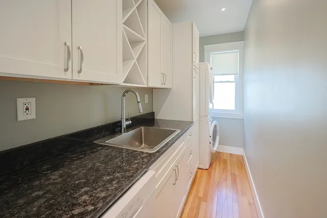 a kitchen with a sink and cabinets