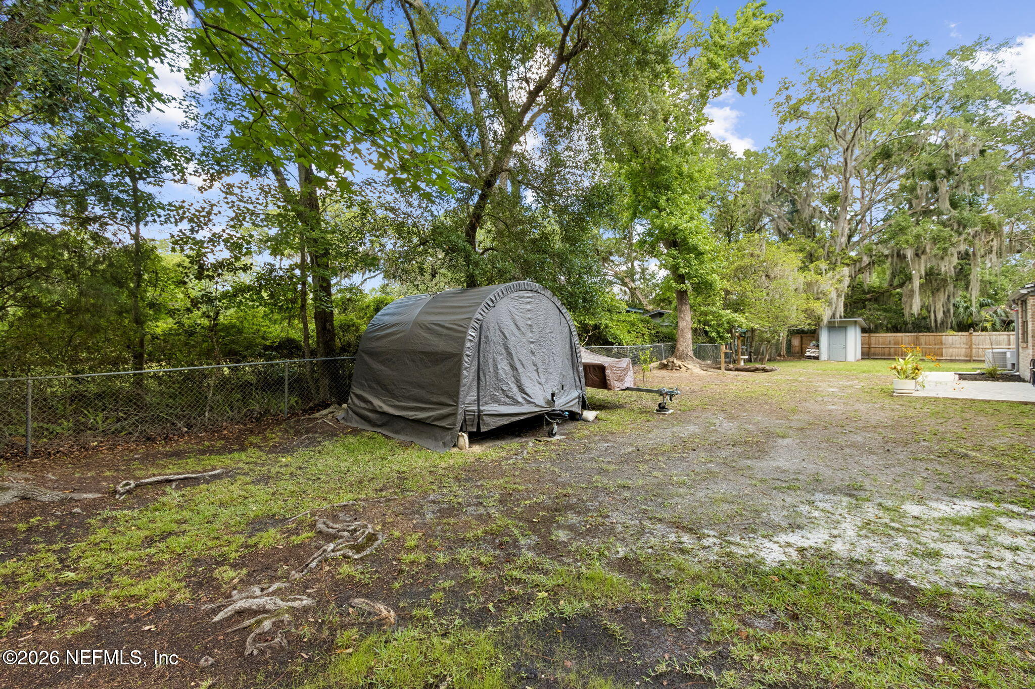 3194 Creighton Landing Road Fleming Island, FL 32003 - Photo 27 of 31 a view of backyard with tree and a wooden fence