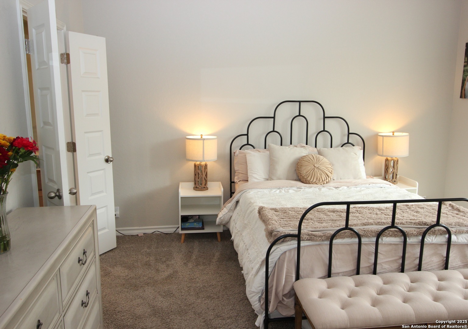 12228 Buckaroo Ranch San Antonio, TX 78254 - Photo 11 of 43 a bedroom with a bed and a flat screen tv