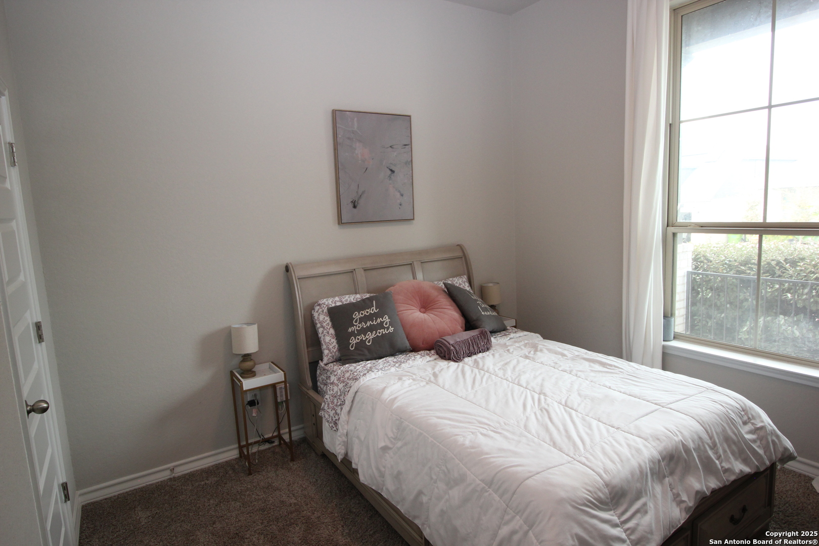 12228 Buckaroo Ranch San Antonio, TX 78254 - Photo 17 of 43 a large bed sitting in a bedroom next to a window