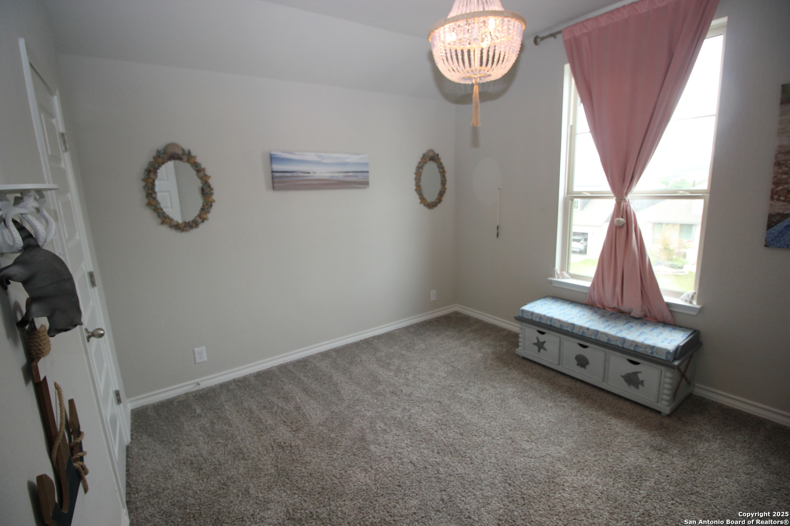 12228 Buckaroo Ranch San Antonio, TX 78254 - Photo 23 of 43 a room with gym equipment and windows