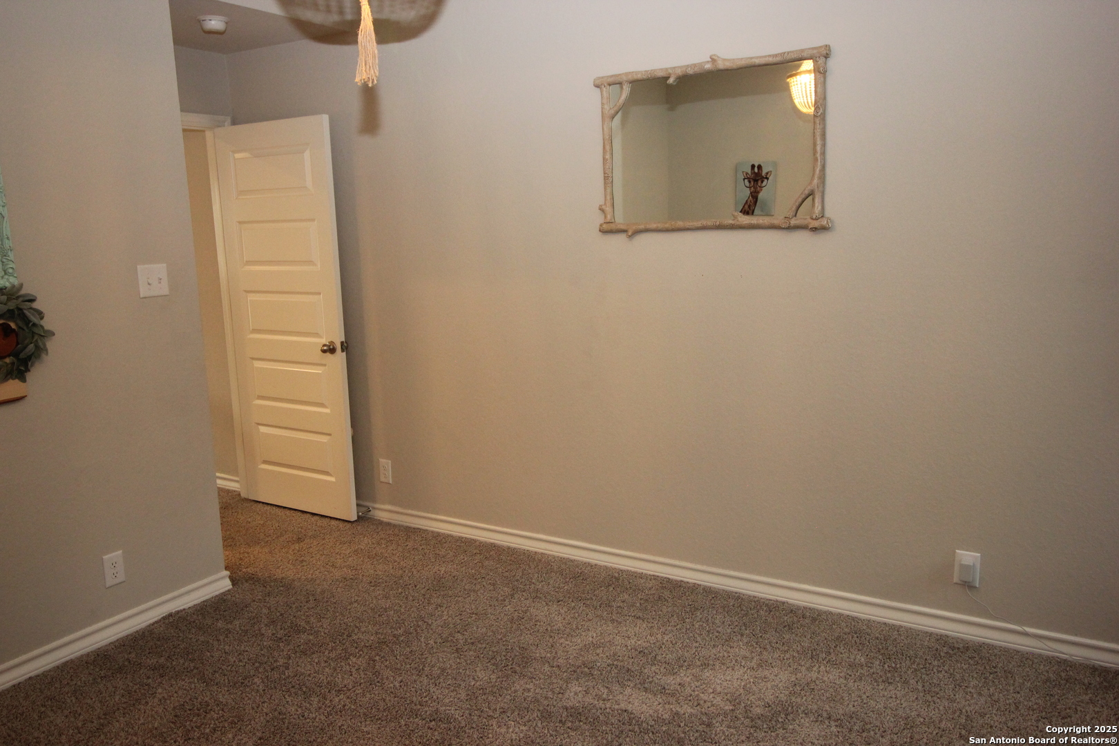 12228 Buckaroo Ranch San Antonio, TX 78254 - Photo 27 of 43 an empty room with windows and bathroom