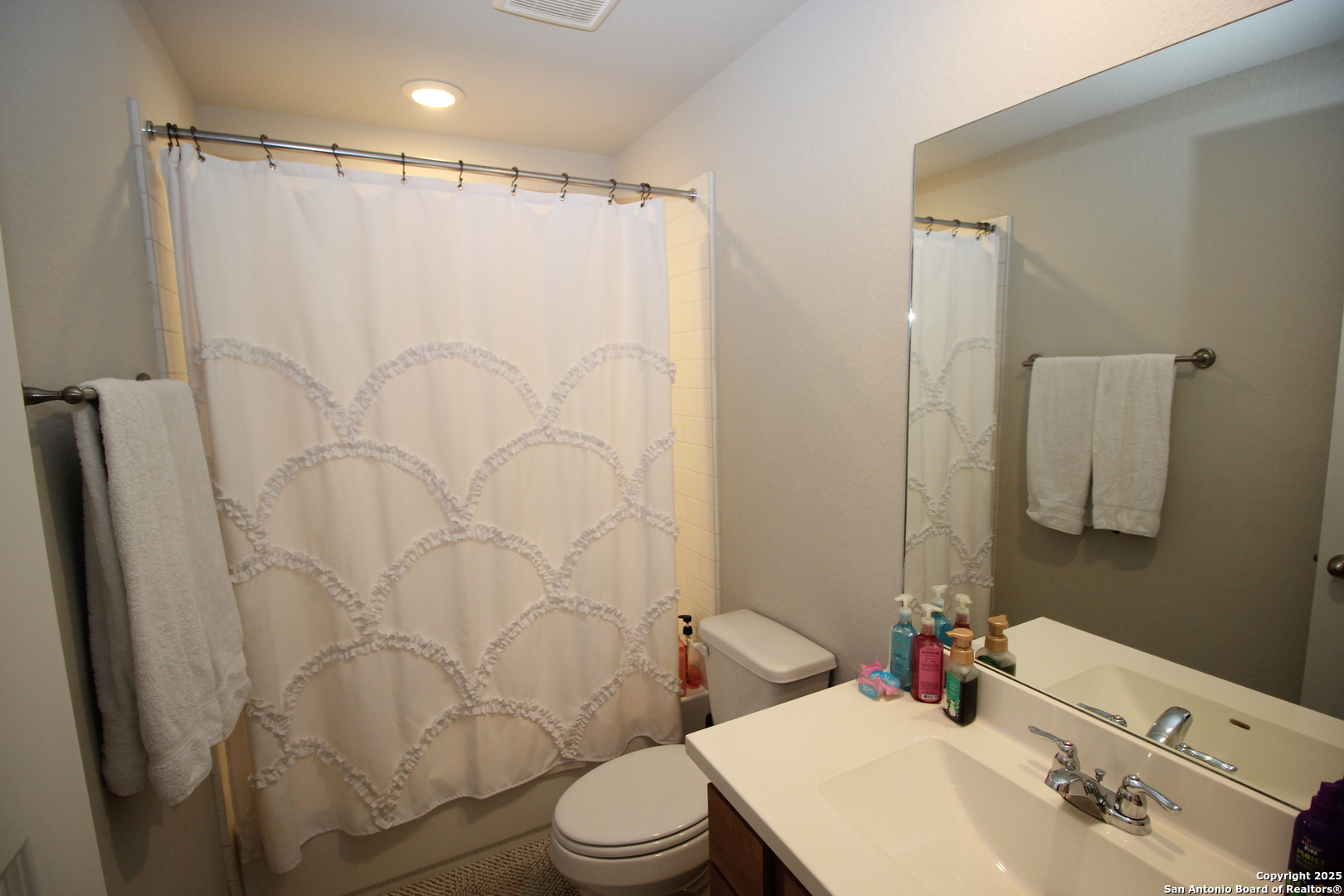 12228 Buckaroo Ranch San Antonio, TX 78254 - Photo 28 of 43 a bathroom with a sink toilet and shower