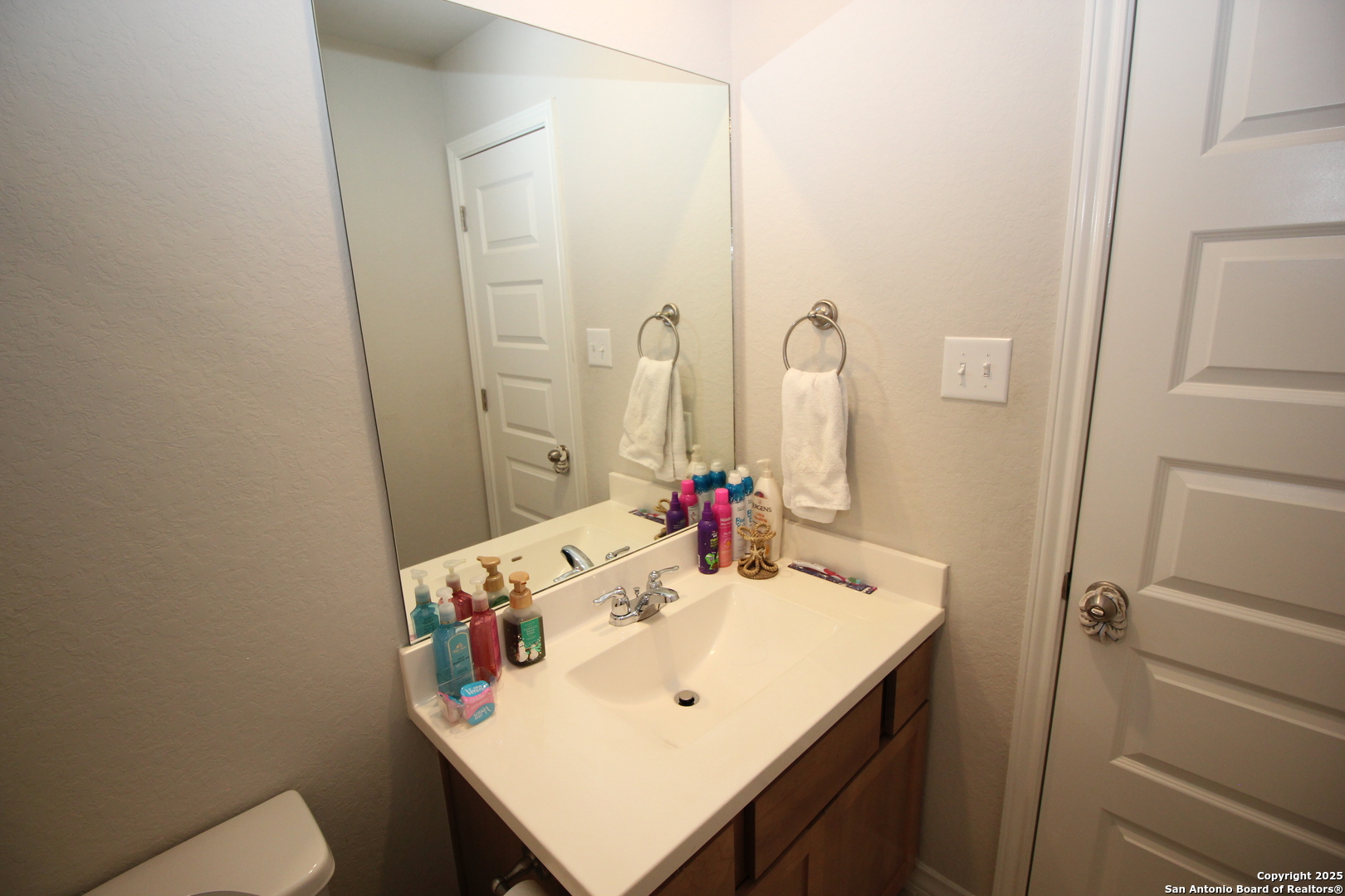 12228 Buckaroo Ranch San Antonio, TX 78254 - Photo 29 of 43 a bathroom with a sink and a mirror