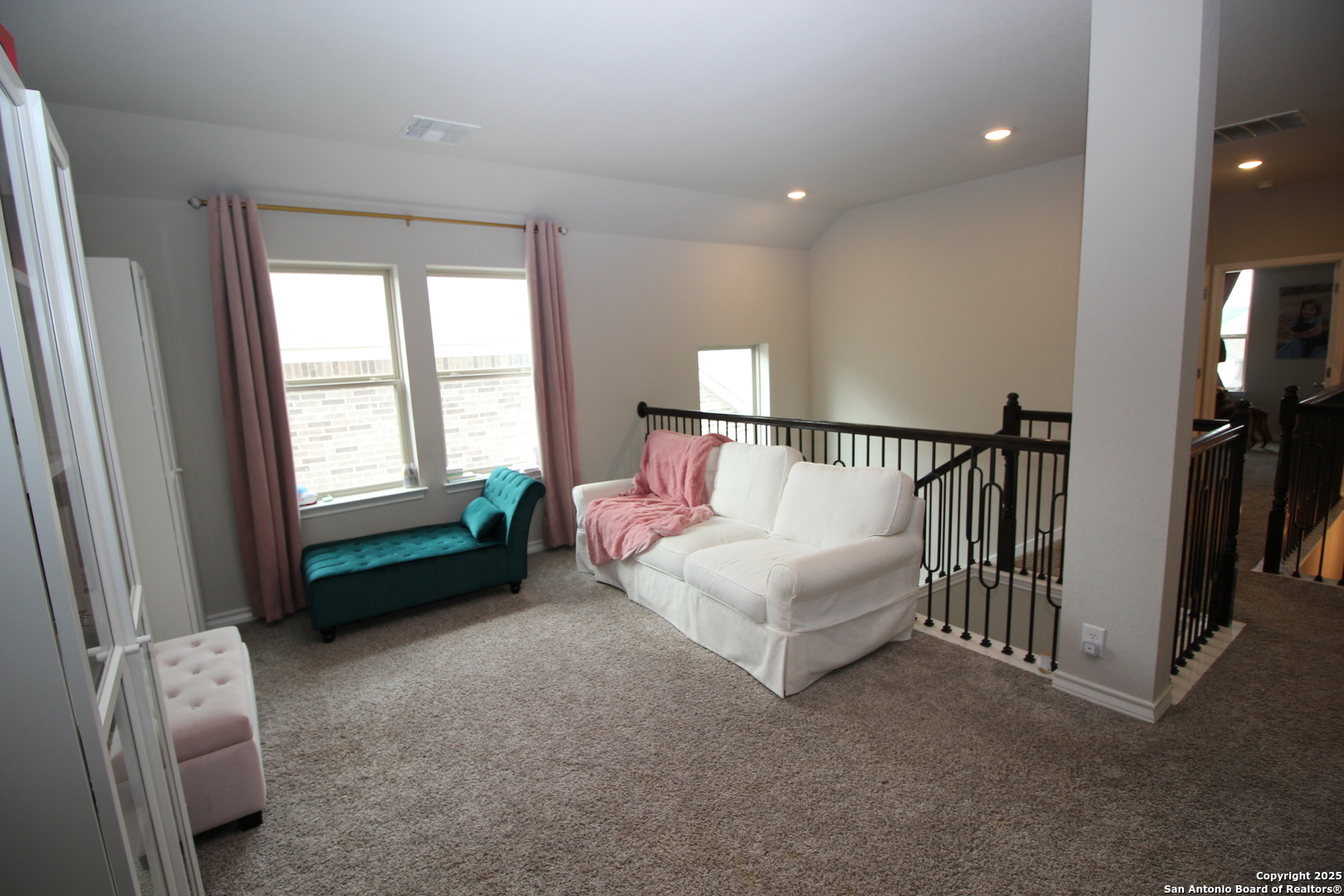 12228 Buckaroo Ranch San Antonio, TX 78254 - Photo 32 of 43 a spacious bedroom with a bed and a window