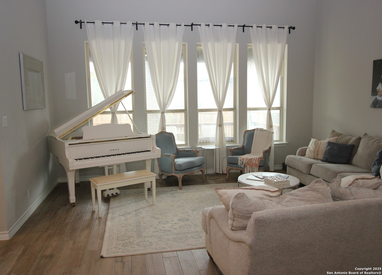 12228 Buckaroo Ranch San Antonio, TX 78254 - Photo 4 of 43 a living room with furniture and a large window