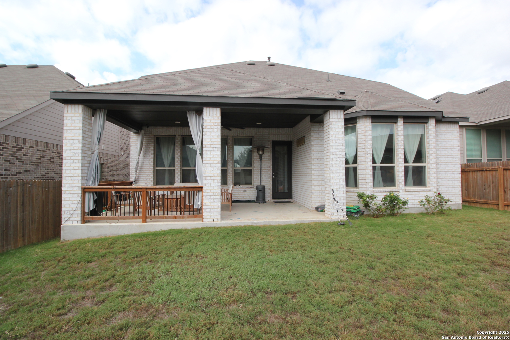12228 Buckaroo Ranch San Antonio, TX 78254 - Photo 43 of 43 a view of a house with backyard porch and sitting area