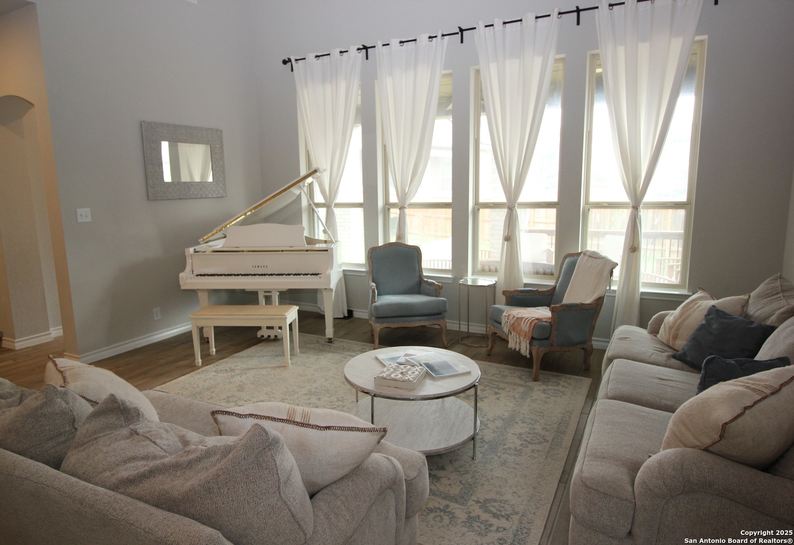 12228 Buckaroo Ranch San Antonio, TX 78254 - Photo 5 of 43 a living room with furniture a large window and a potted plant