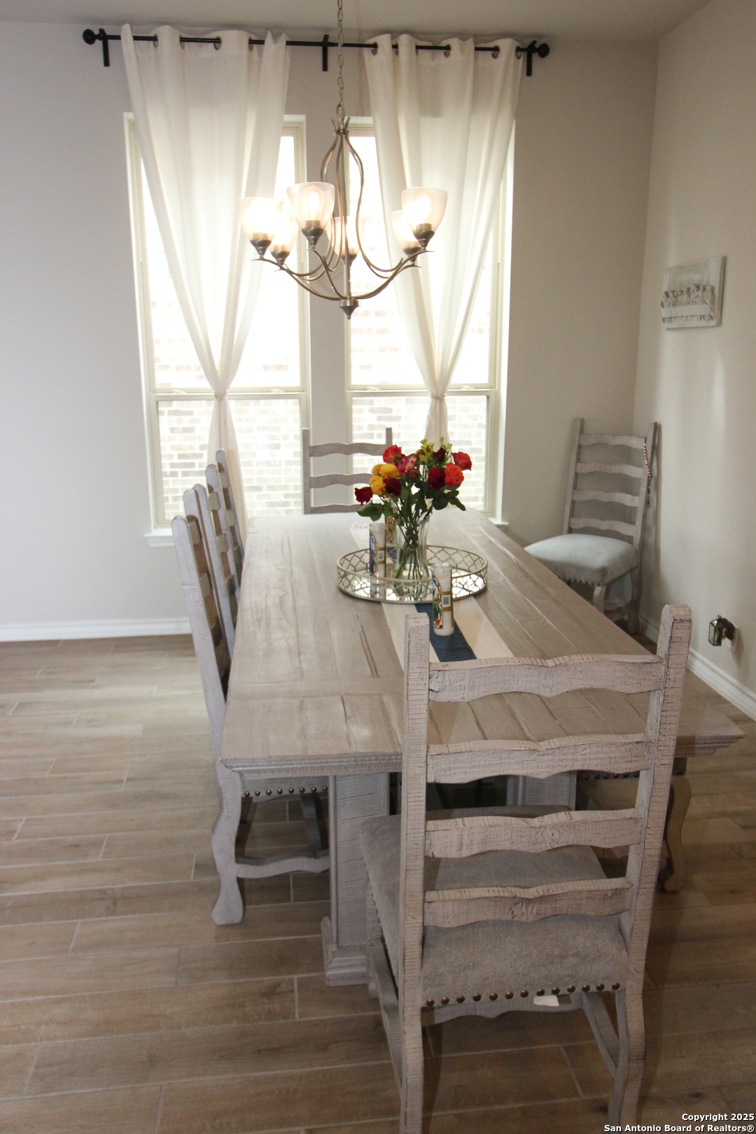 12228 Buckaroo Ranch San Antonio, TX 78254 - Photo 6 of 43 a view of a dining room with furniture and chandelier