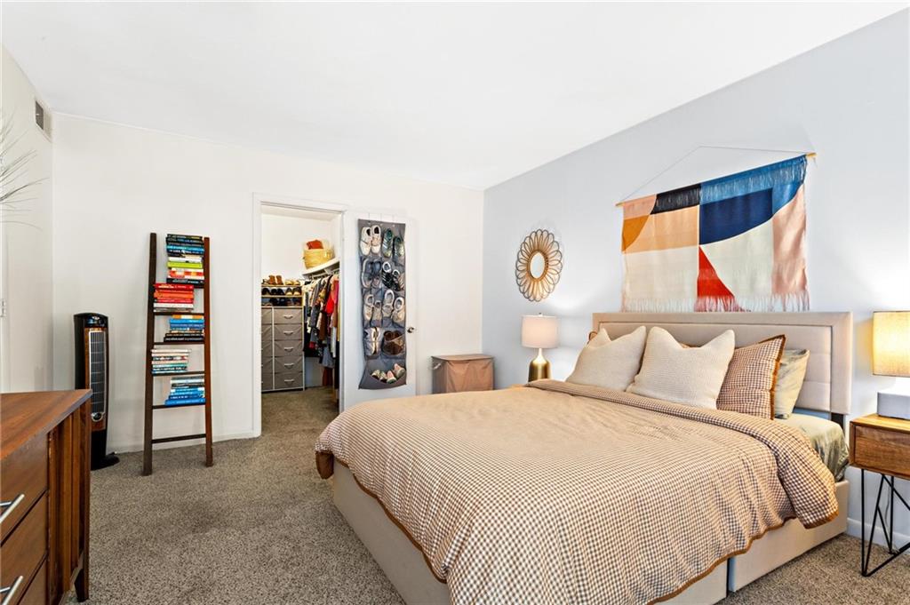 1150 Collier Road Northwest, Unit A10 Atlanta, GA 30318 - Photo 17 of 34 a bedroom with a bed and a large window