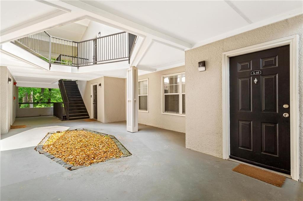 1150 Collier Road Northwest, Unit A10 Atlanta, GA 30318 - Photo 24 of 34 an entryway with a livingroom and fireplace
