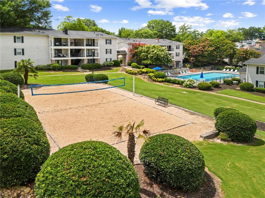 1150 Collier Road Northwest, Unit A10 Atlanta, GA 30318 - Photo 28 of 34 a view of a house with a yard and plants