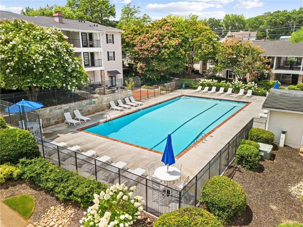 1150 Collier Road Northwest, Unit A10 Atlanta, GA 30318 - Photo 31 of 34 an aerial view of a house with swimming pool patio and outdoor seating