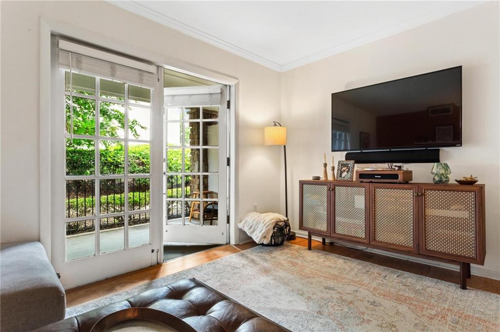 1150 Collier Road Northwest, Unit A10 Atlanta, GA 30318 - Photo 6 of 34 a living room with furniture and a flat screen tv