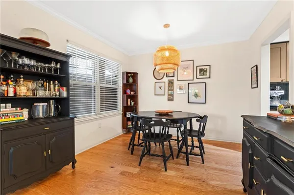 a view of a dining room with furniture and window