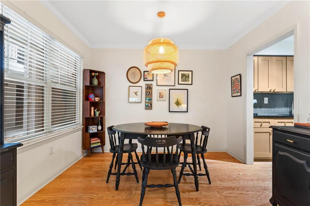 1150 Collier Road Northwest, Unit A10 Atlanta, GA 30318 - Photo 9 of 34 a view of a dining room with furniture and window
