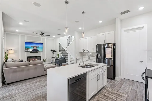 a view of a dining room with a table and chairs