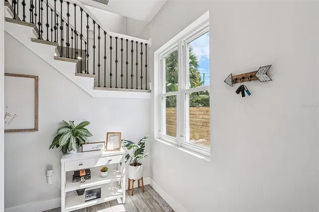 a view of a hallway with a door and a window