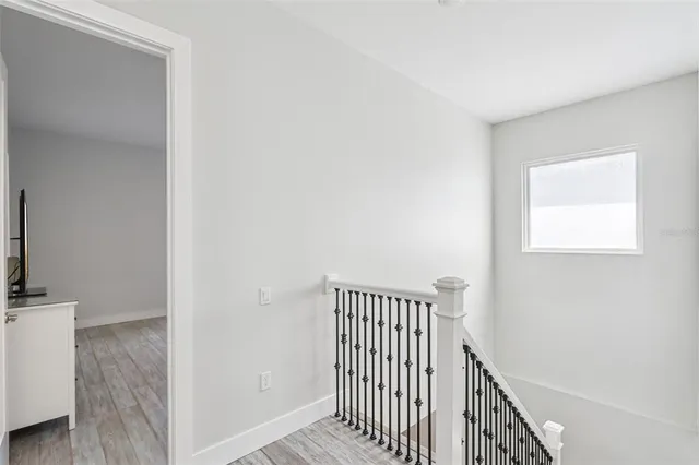 a bedroom with a bed and a table