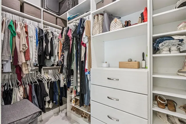 a work room with furniture and a mirror